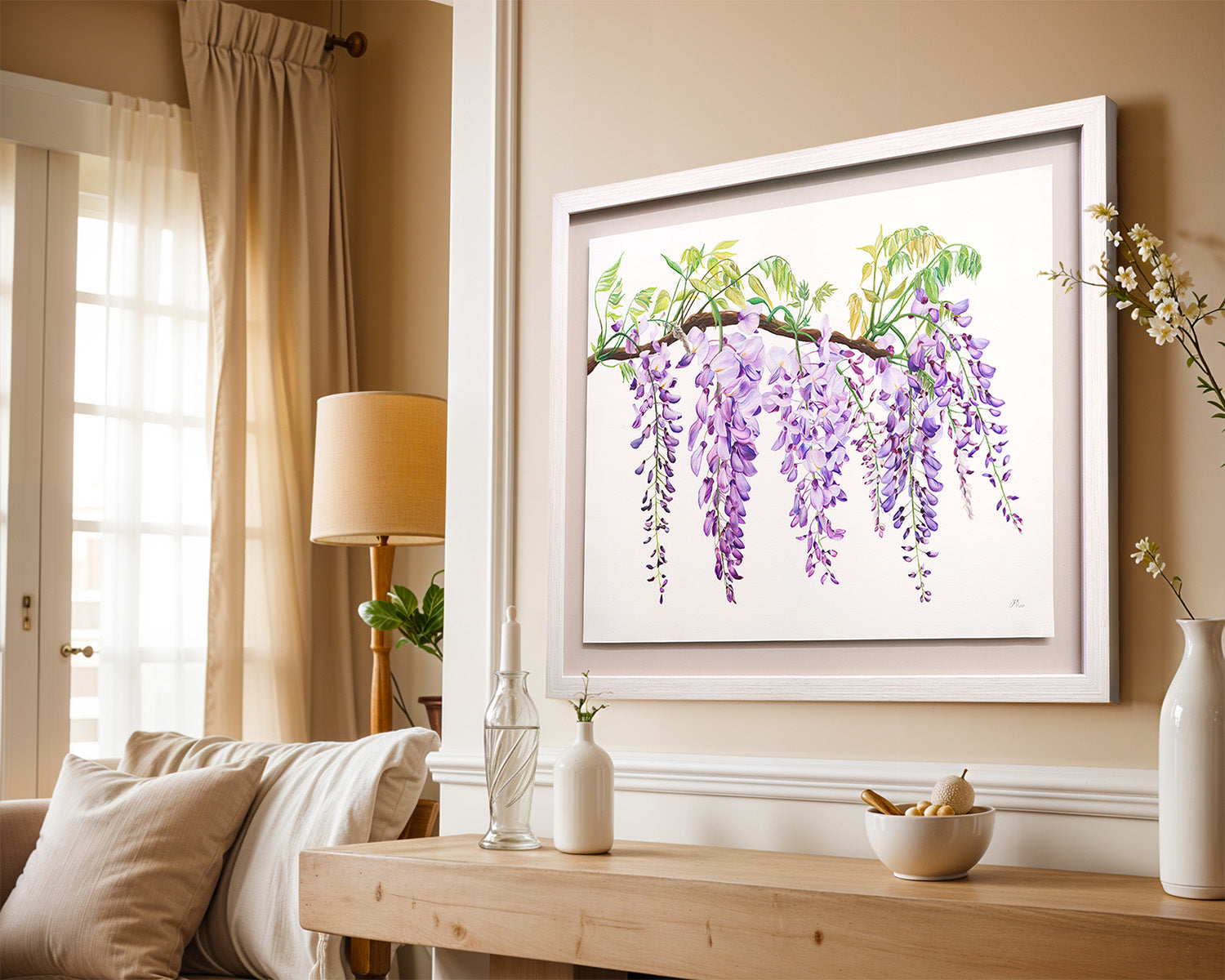 Framed artwork of wisteria flowers on a wall in a living room.